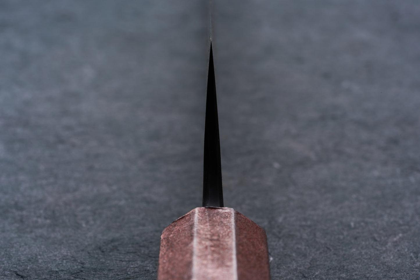 Mazaki Aoichi Beads Black Damascus Sujihiki 300mm knife, featuring a bronze bolster and thin black blade, ideal for precise slicing of meats and proteins.