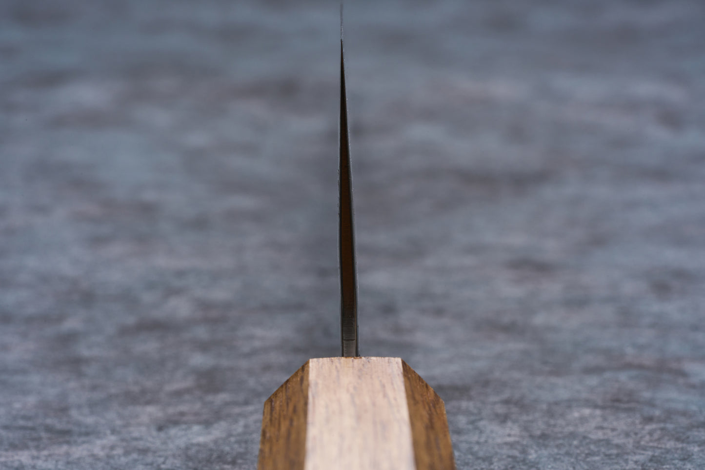 Tsunehisa AUS10 Sanjushichi 参拾漆 Nawame Damascus Gyuto 240mm T-03709 blade viewed head-on, showcasing its precision edge and wooden handle.