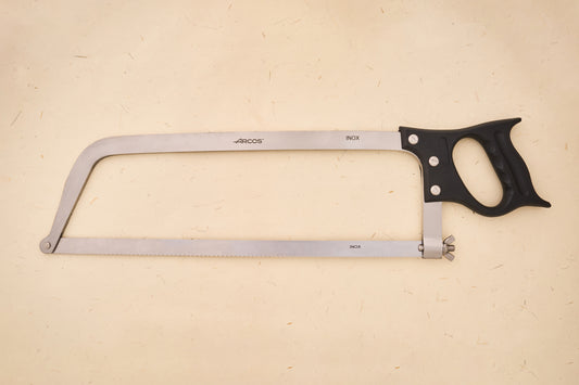 Arcos Butcher Saw with stainless steel frame, replaceable blade, and black pistol grip handle, showcasing Arcos' centuries-old blade craftsmanship and innovation.