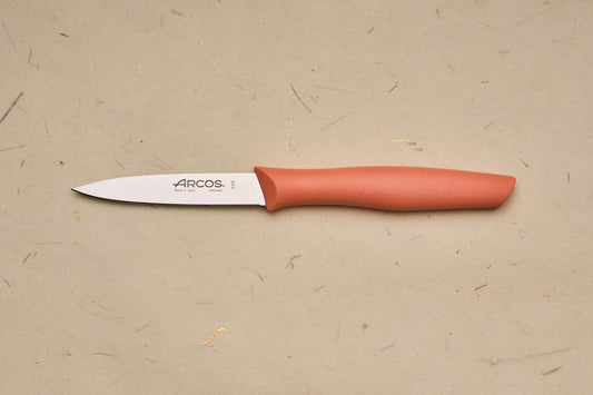 Arcos Nova Paring Knife with a narrow stainless blade and ergonomic handle, showcasing Spanish craftsmanship on a neutral surface, embodying precision and heritage.