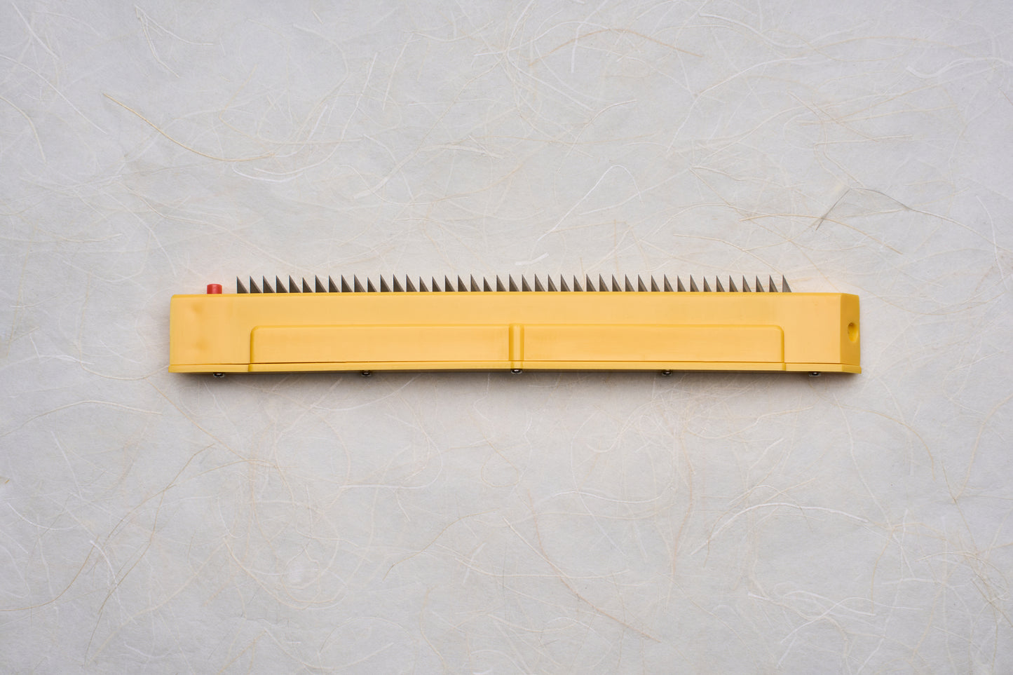 Replacement Blades for Chiba Mandoline Slicers, featuring a yellow plastic body with sharp metal tines for precise cutting, ideal for culinary enthusiasts seeking quality tools.