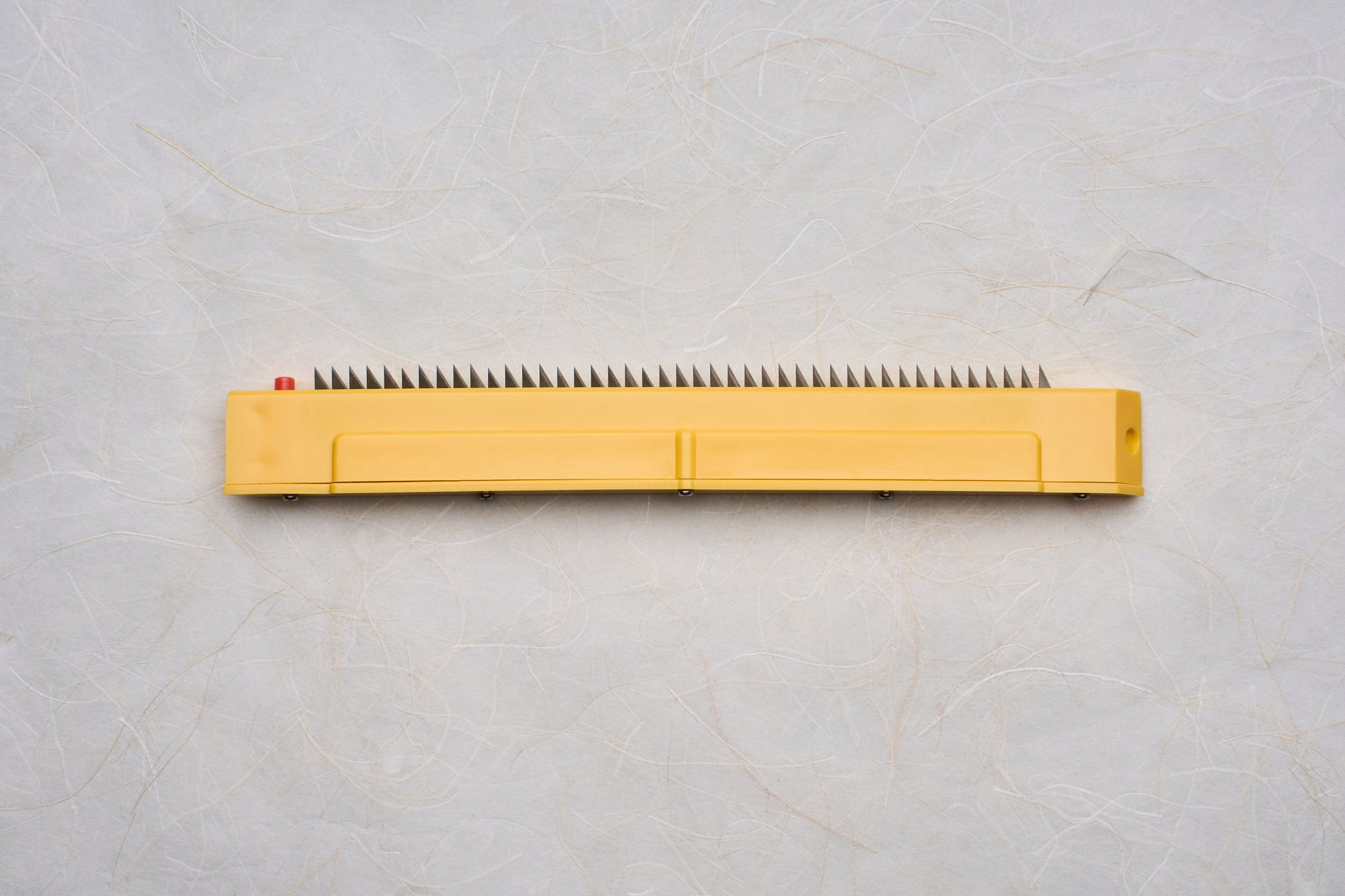 Replacement Blades for Chiba Mandoline Slicers featuring a yellow handle and sharp triangular metal teeth, ideal for precise slicing tasks.