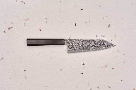 Hatsukokoro Ryuhyo SG2 Kurozome Damascus Bunka 180mm knife, featuring a wavy-patterned Damascus blade and a dark wooden handle, crafted by skilled artisans for precision and elegance.