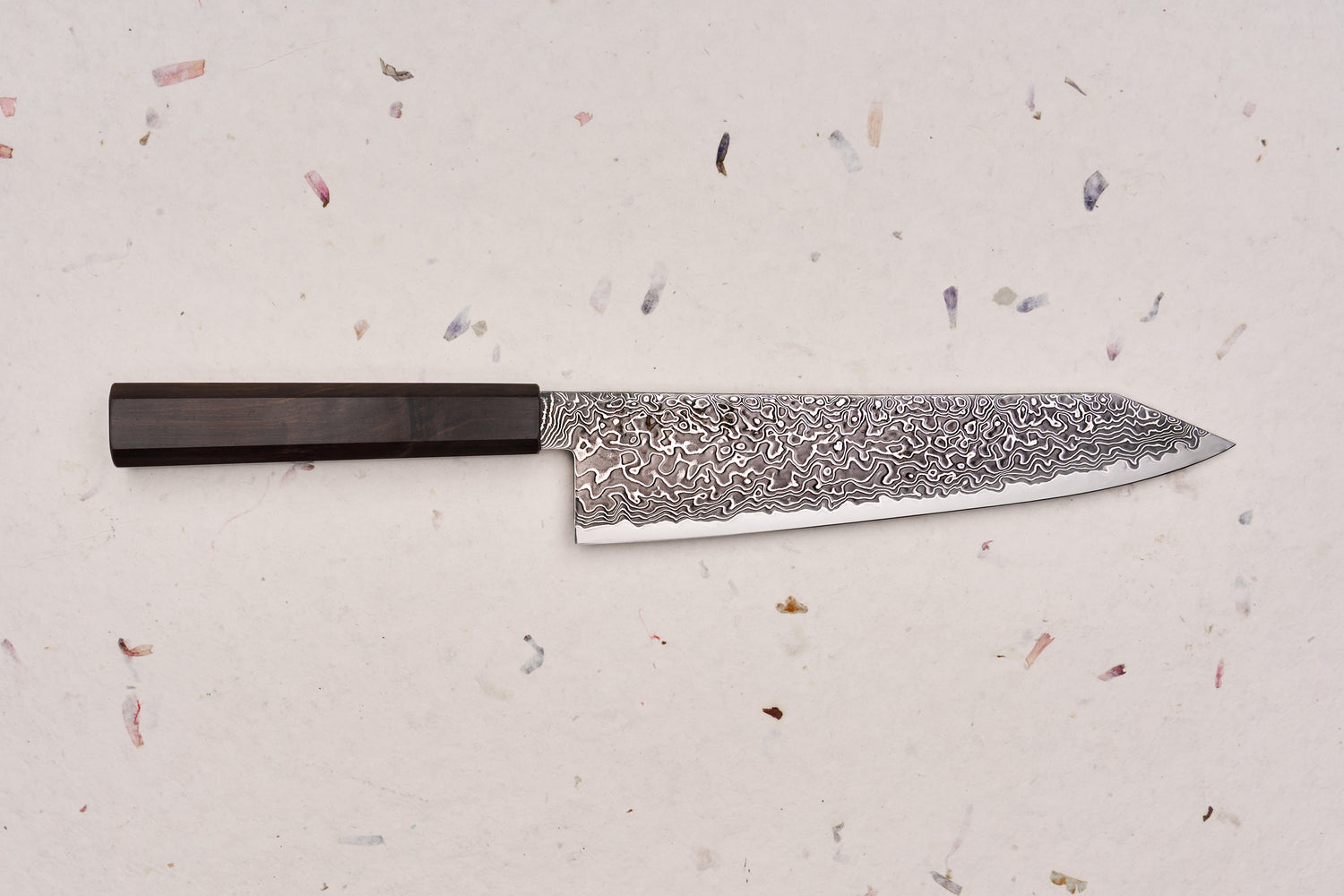 Hatsukokoro Ryuhyo SG2 Kurozome Damascus Kiritsuke Gyuto 210mm features a swirling Damascus steel blade and dark octagonal handle, embodying Japanese craftsmanship for precision and elegance.