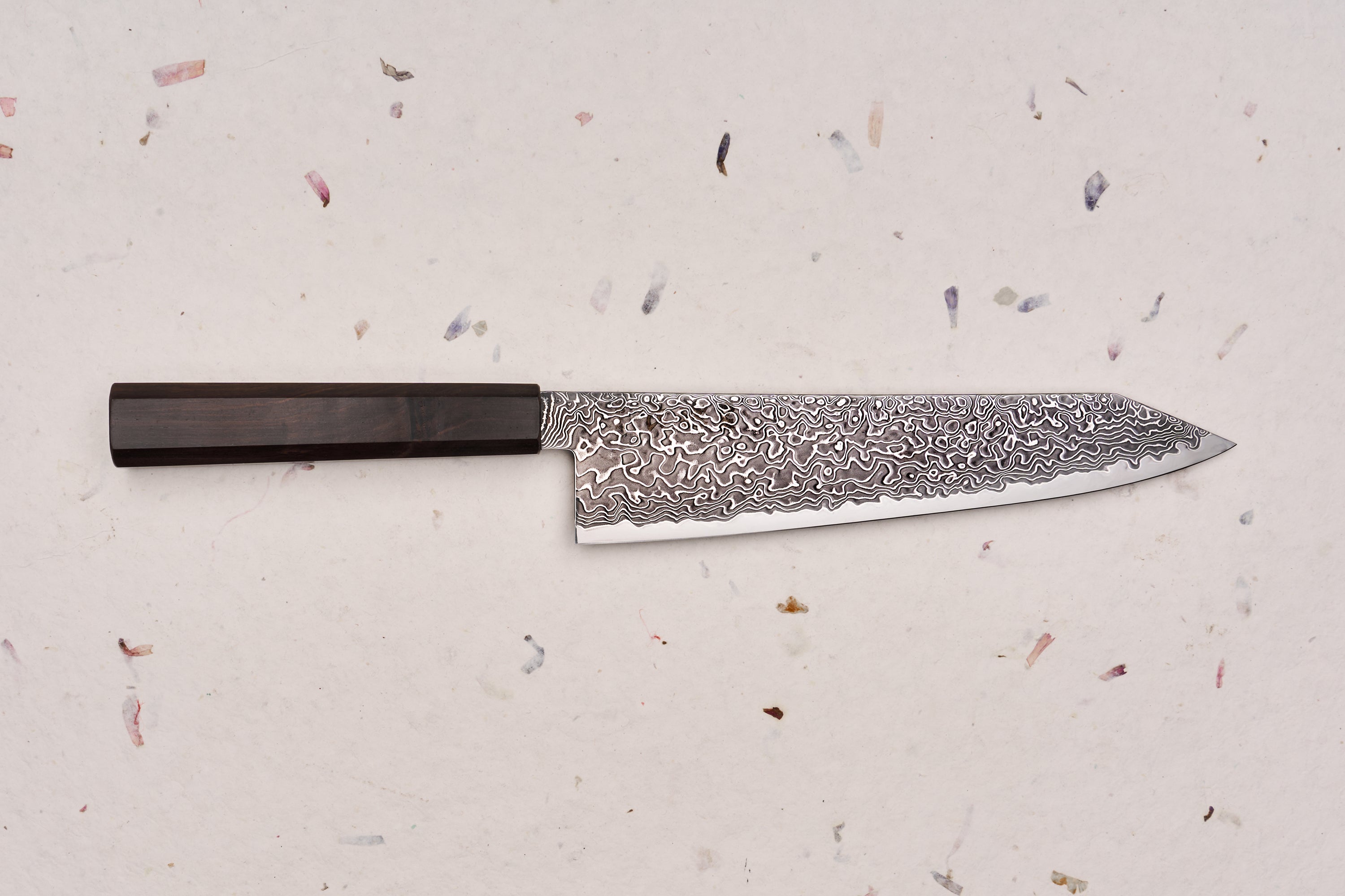 Hatsukokoro Ryuhyo SG2 Kurozome Damascus Kiritsuke Gyuto 210mm features a swirling Damascus steel blade and dark octagonal handle, embodying Japanese craftsmanship for precision and elegance.