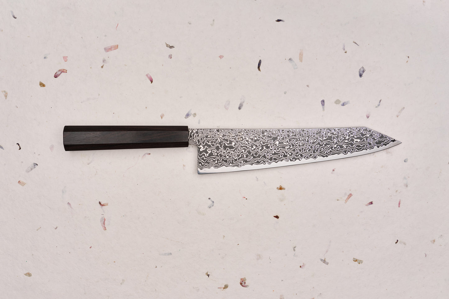 Hatsukokoro Ryuhyo SG2 Kurozome Damascus Kiritsuke Gyuto 240mm, featuring a Damascus-patterned blade and dark octagonal handle, embodying Japanese craftsmanship with a sleek, multi-purpose design.