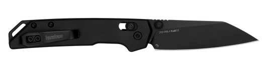 Kershaw Iridium Reverse Tanto knife with black handle, tanto-style blade, and slim pocket-clip, showcasing precision-focused design and practical deployment features.