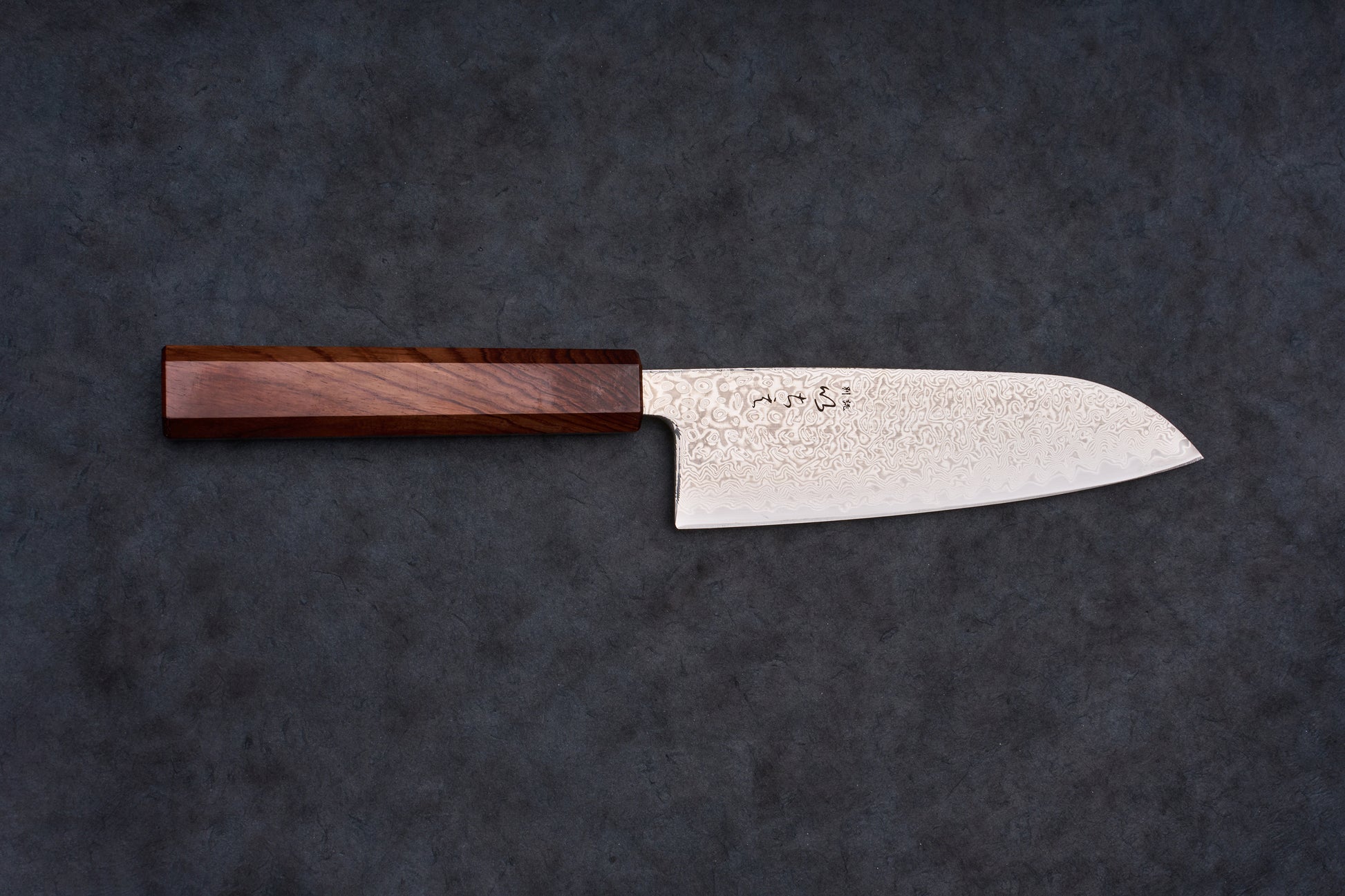 Ichie SRS13 Damascus Santoku 165mm knife with octagonal handle and Damascus-patterned blade, featuring kanji markings, ideal for slicing, dicing, and mincing tasks.