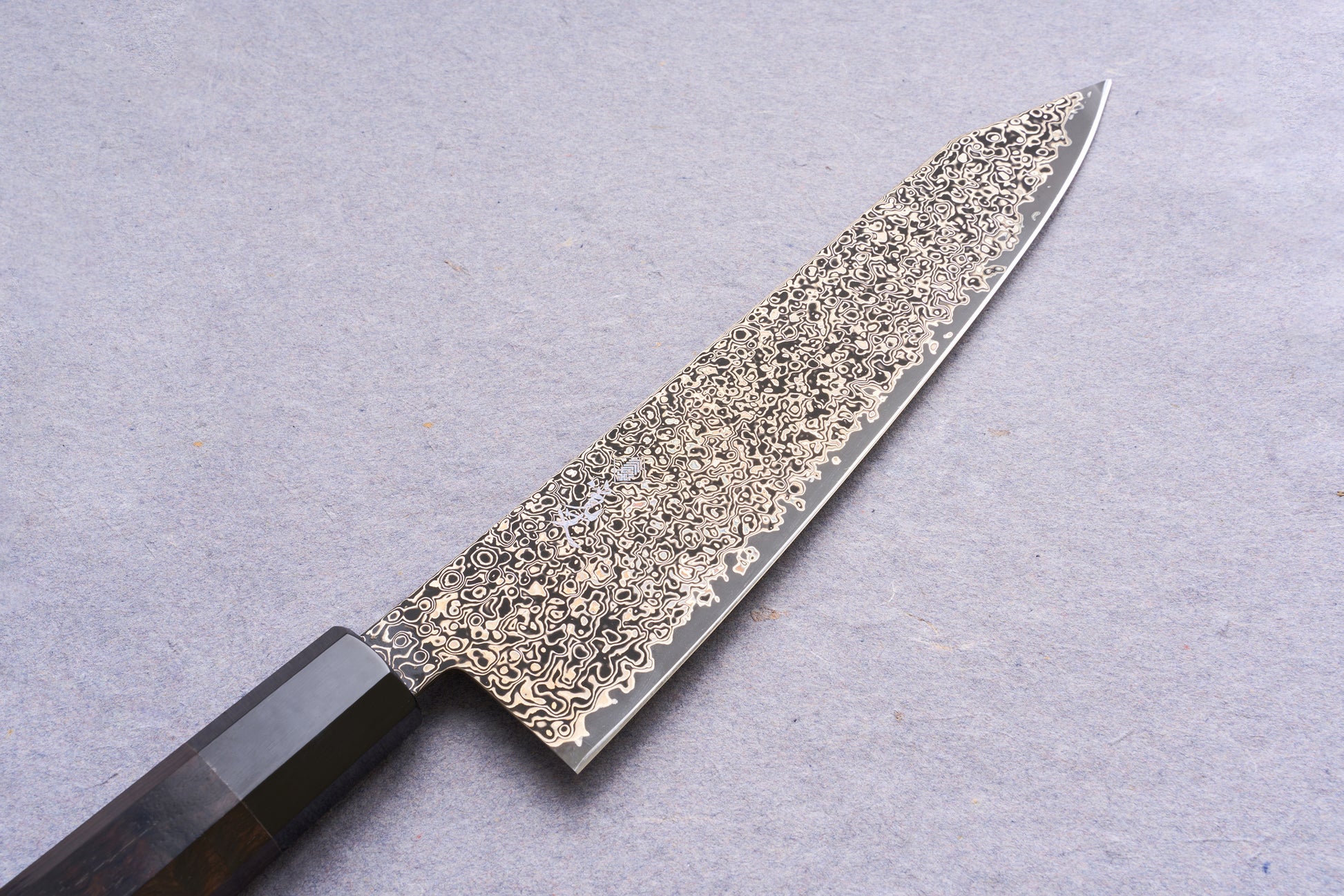 Kanjo SG2 Nickel Damascus Kiritsuke Gyuto 240mm, featuring a swirling Damascus steel blade and octagonal wooden handle, ideal for precision meat and fish cutting.