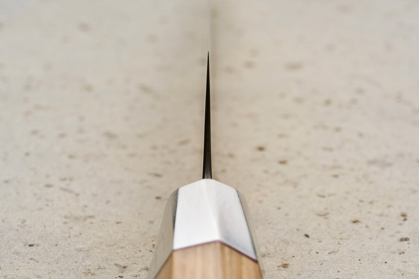 Mcusta Zanmai Beyond Kiritsuke Petty 150mm: A precision-crafted knife with a sleek, dark spine and Hinoki wood handle, ideal for delicate tasks like slicing shallots, embodying luxury and traditional Japanese craftsmanship.