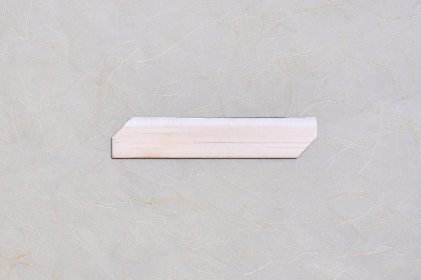 Replacement Blades for Chiba Mandoline Slicers displayed on a textured surface, showcasing their precision-crafted, angled design for enhanced slicing performance.