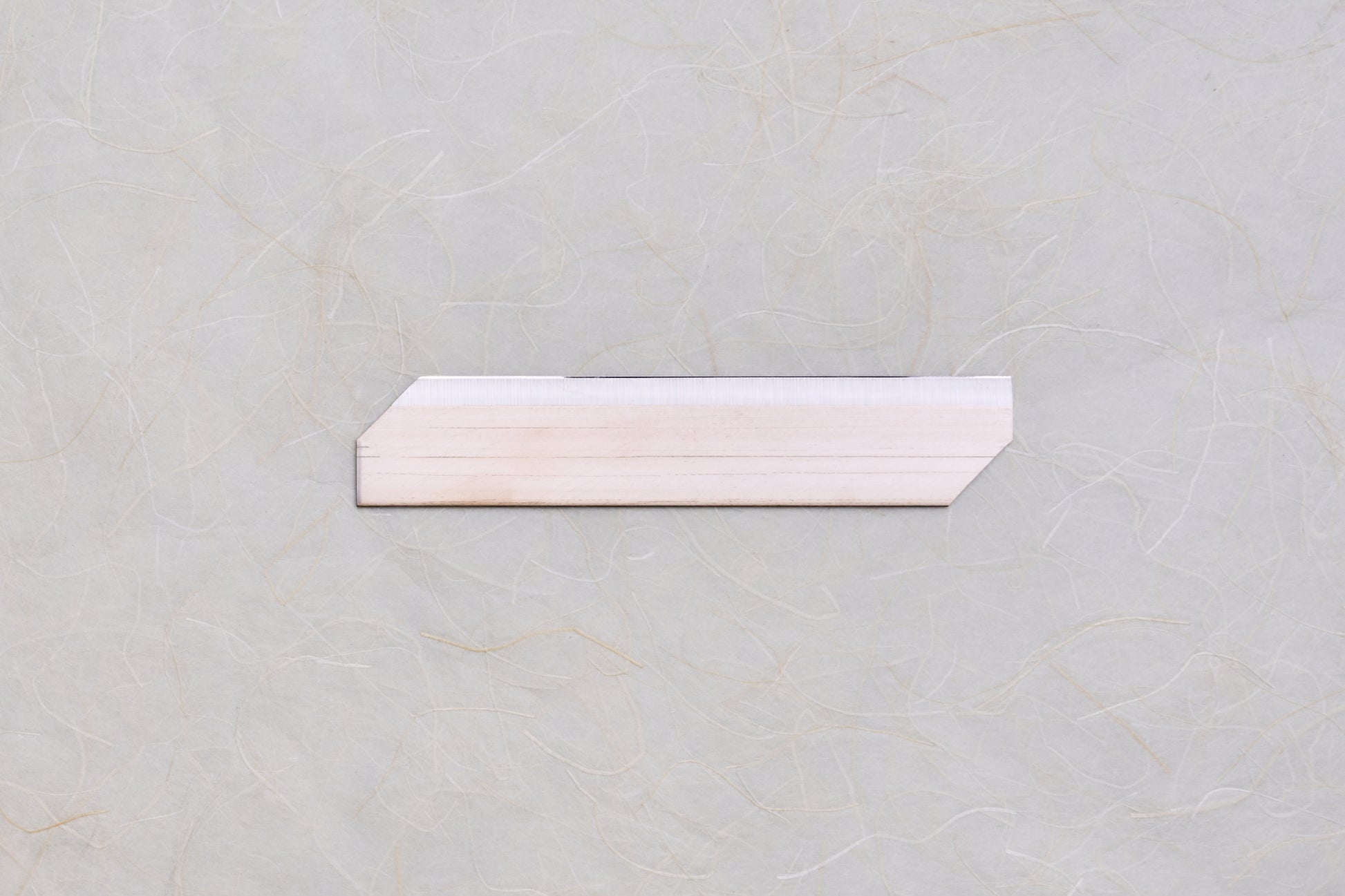 Replacement Blades for Chiba Mandoline Slicers, featuring a trapezoidal wooden shim with chamfered ends, ideal for precise slicing adjustments in Japanese kitchen tools.