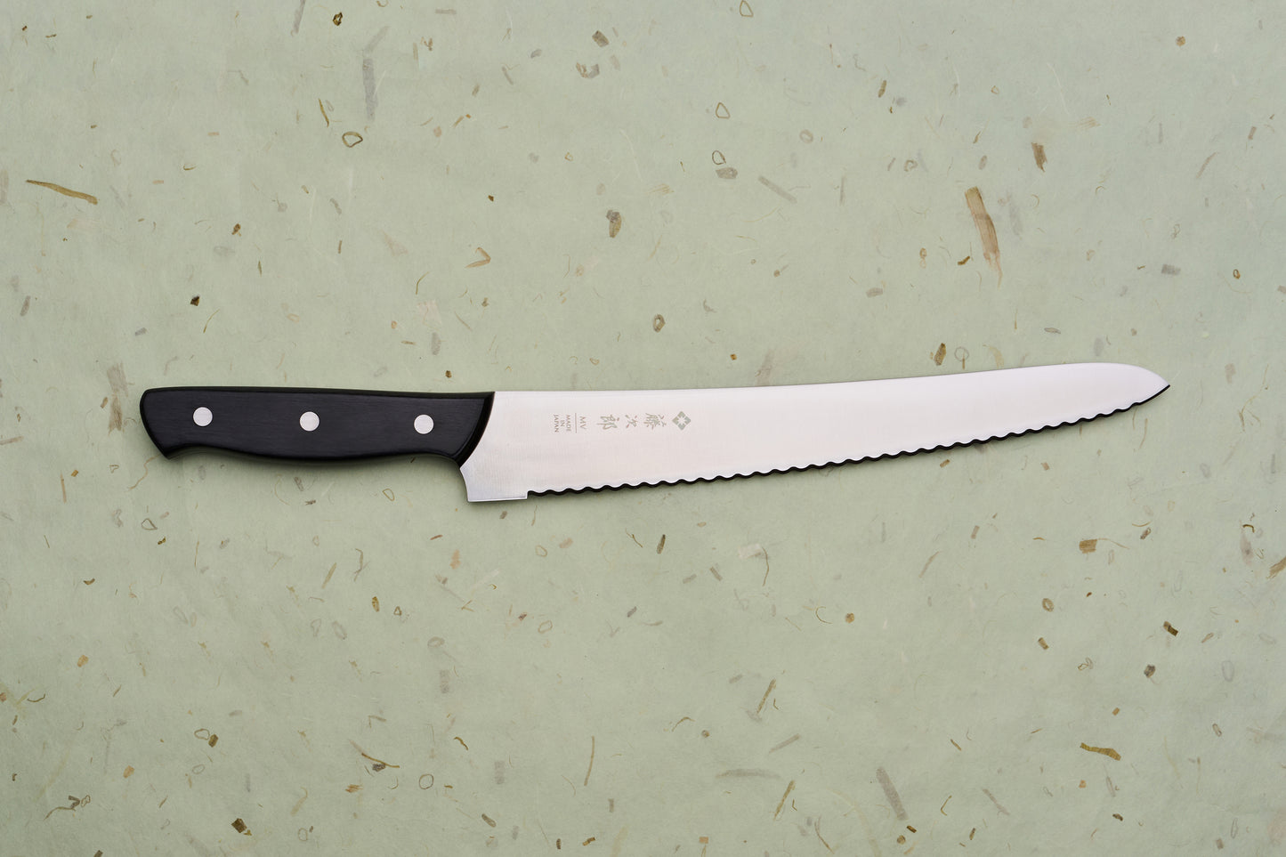 TOJIRO Bread knife 270mm F-687 with scalloped serrations and a black riveted handle, designed for effortlessly slicing bread while minimizing crumbs.