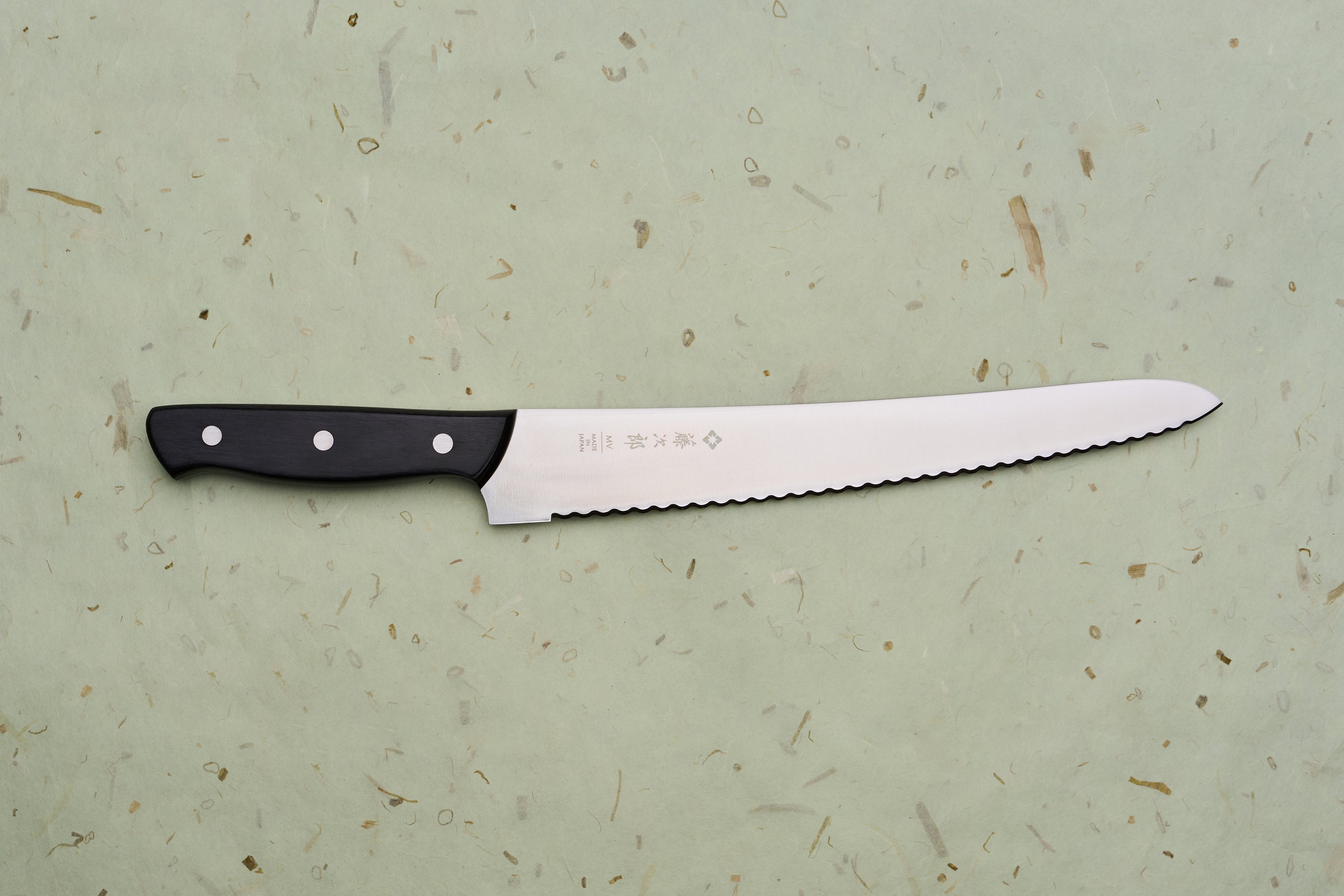 TOJIRO Bread knife 270mm F-687 with scalloped serrations and a black riveted handle, designed for effortlessly slicing bread while minimizing crumbs.