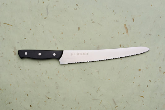 TOJIRO Bread knife 270mm F-687 with scalloped serrations and a black riveted handle, designed for effortlessly slicing bread while minimizing crumbs.