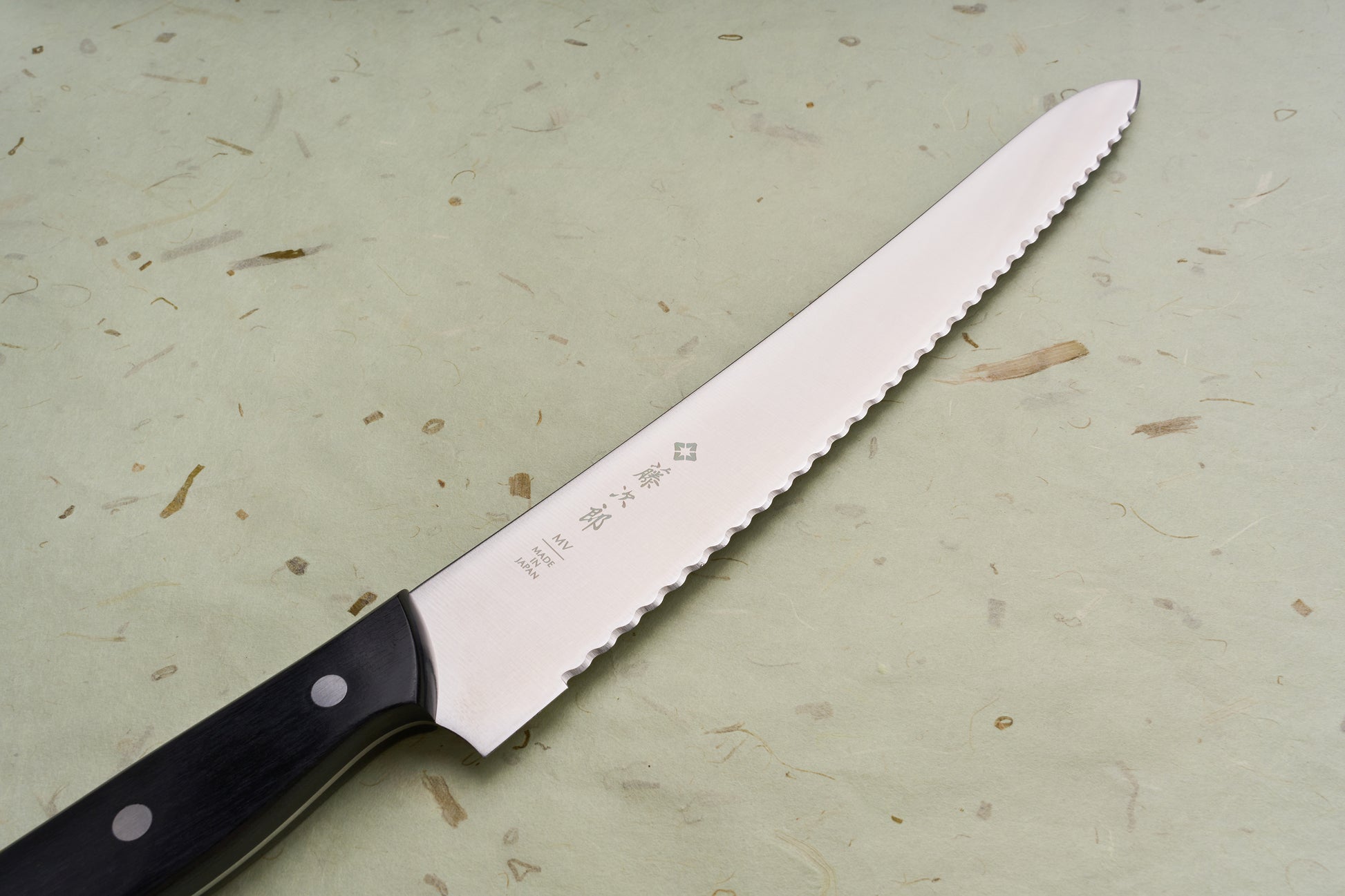 TOJIRO Bread knife 270mm F-687 with scalloped serrations, Japanese characters, and dark wood handle, designed for smooth slicing of bread.