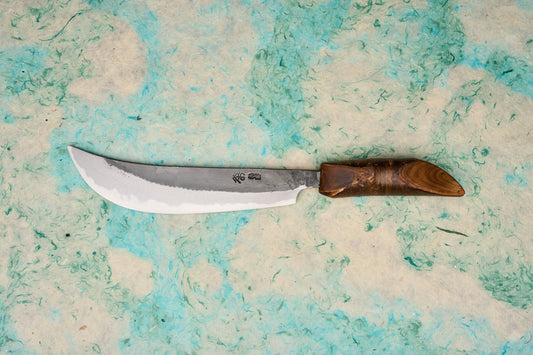 Tottori Otsuka Hamono Aoichi Samurai Knife 180mm, featuring a single-edged, hand-forged Aogami #1 carbon steel blade with a curved design, paired with a polished cherrywood handle, exemplifying expert craftsmanship.