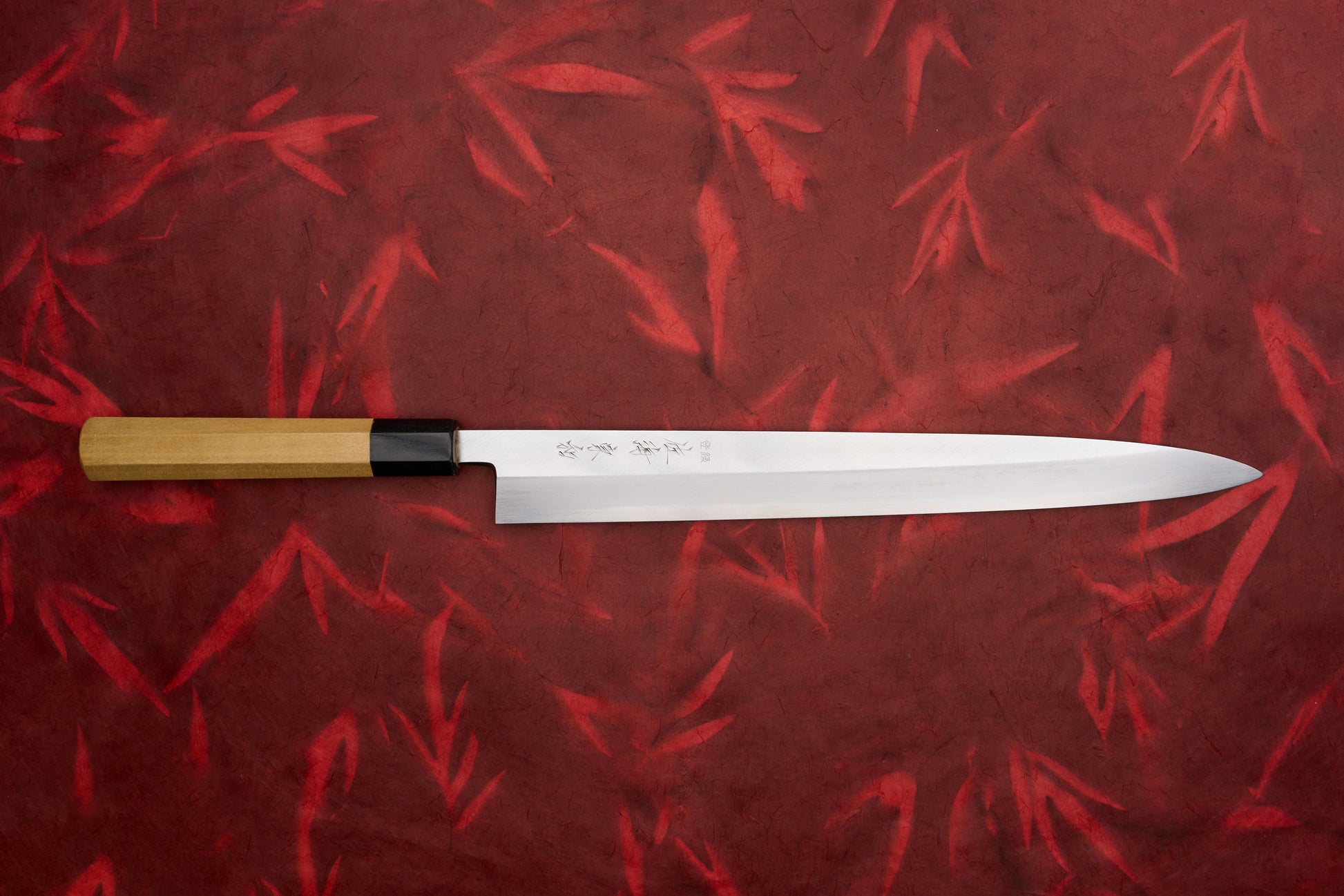Touroku Sakai Tohwa Shirogami Yanagiba 300mm features a sleek, stainless-steel blade with Japanese etching and a straight wooden handle, ideal for precise sashimi slicing by Knifewear.
