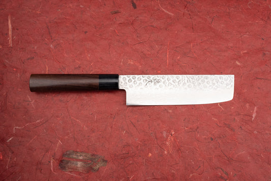 Tsunehisa VG10 Juroku 拾陸 Tsuchime Damascus Wa Nakiri 165mm T-01606: A Japanese vegetable knife featuring a hammered blade with Damascus layering and an octagonal dark wooden handle, perfect for precise vegetable chopping.