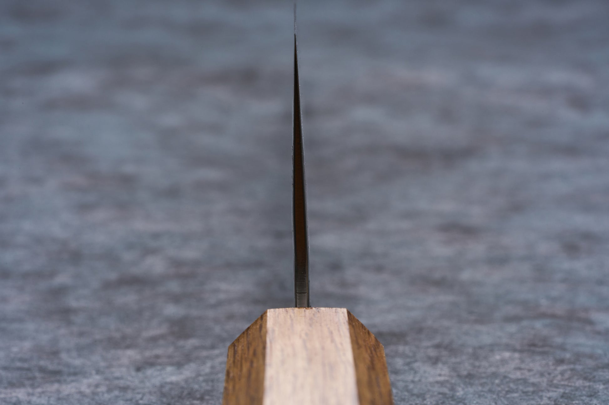Tsunehisa AUS10 Sanjushichi 参拾漆 Nawame Damascus Gyuto 240mm T-03709 blade viewed head-on, showcasing its precision edge and wooden handle.