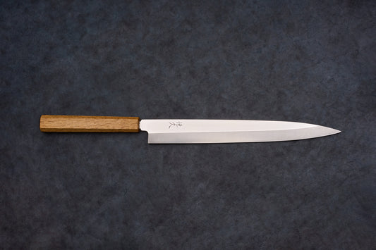 Tsunehisa AUS8 Sanjukyu 参拾玖 Migaki Yanagiba 270mm T-03919, a single-bevel Japanese slicing knife, features a steel blade with engraved characters and an octagonal wooden handle.