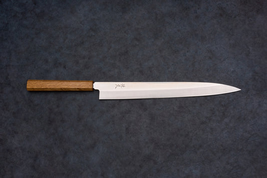 Tsunehisa AUS8 Sanjukyu Yanagiba 300mm, a polished steel Japanese slicing knife with kanji engraving and octagonal wooden handle, ideal for precise sashimi cuts.