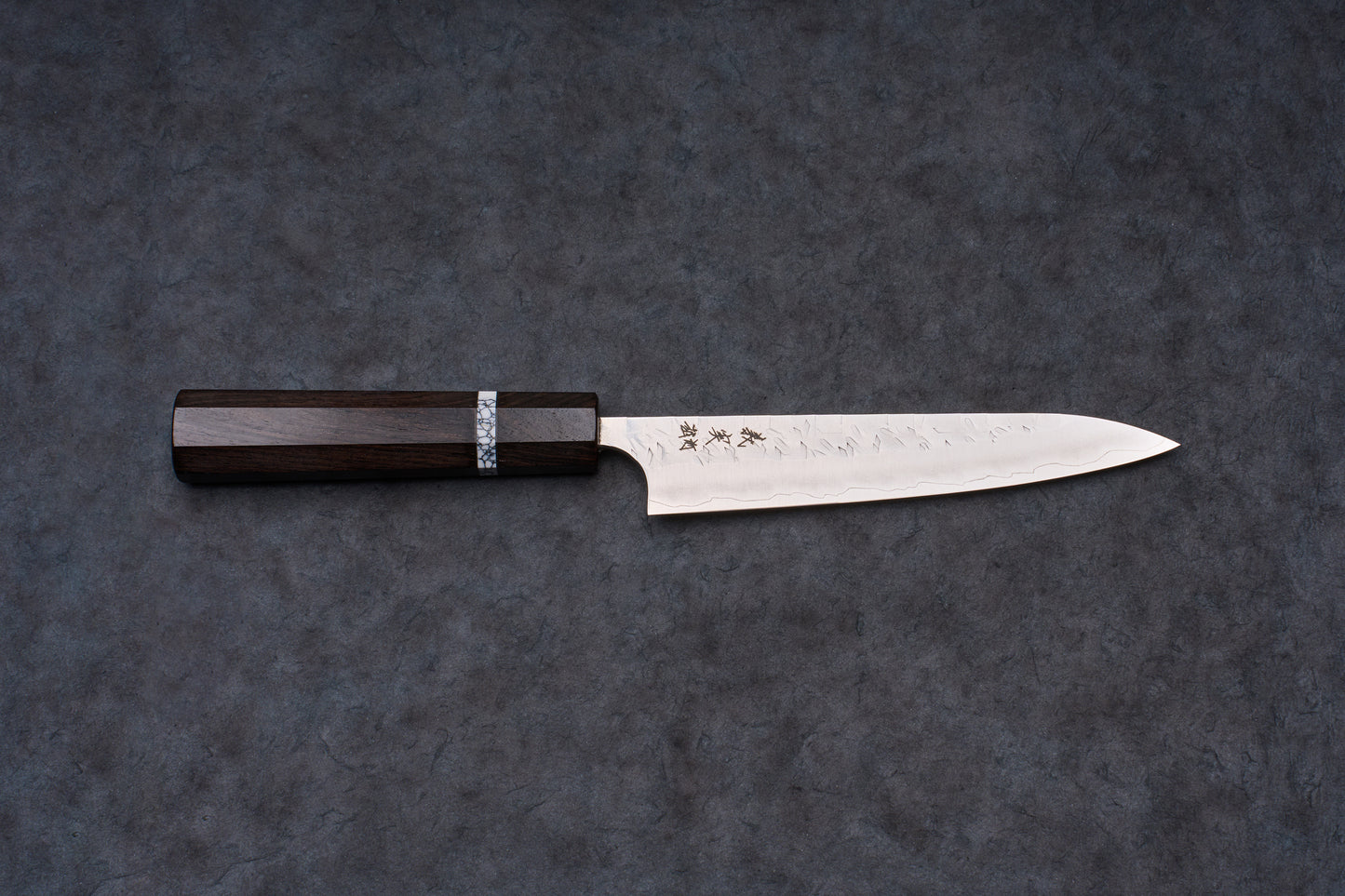 Yoshimi Kato SG2 Hyo Petty 150mm knife, featuring a slender steel blade with a hammered texture, etched Japanese characters, and an octagonal dark wood handle.