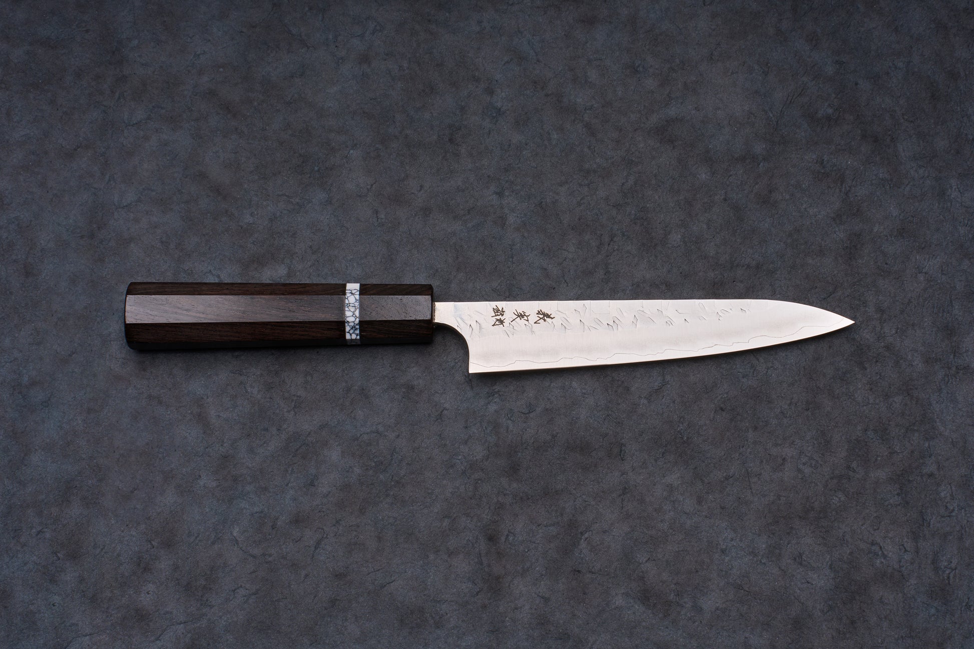 Yoshimi Kato SG2 Hyo Petty 150mm knife, featuring a slender steel blade with a hammered texture, etched Japanese characters, and an octagonal dark wood handle.