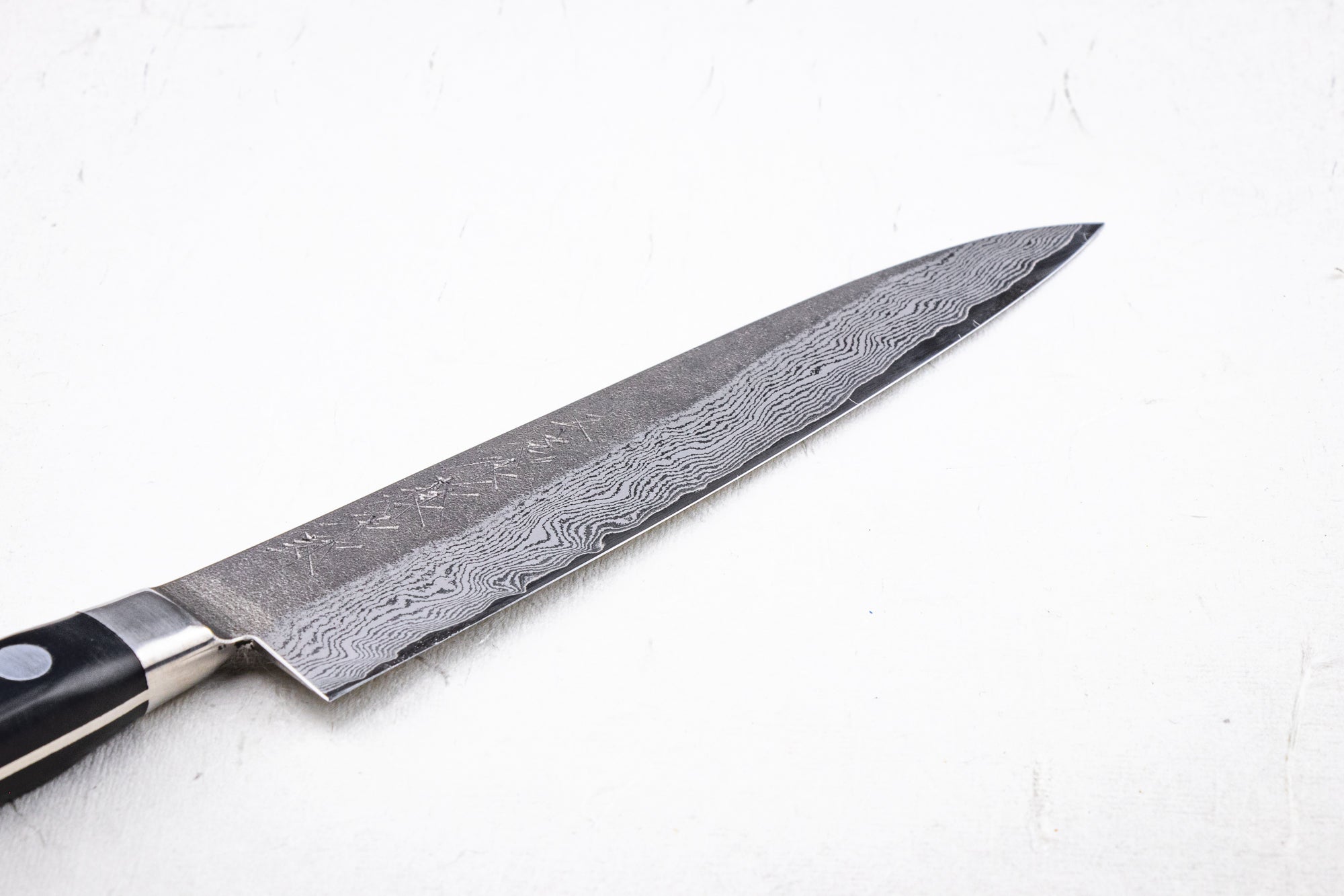 https://knifewear.com/cdn/shop/files/tojiro-atelier-petty-150-2.jpg?v=1701212058