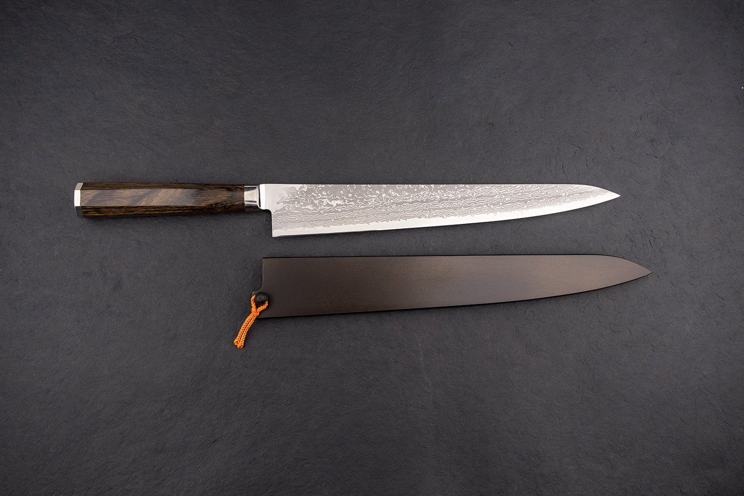 https://knifewear.com/cdn/shop/products/takamura-uchigumo-suji-270-1.jpg?v=1551817160